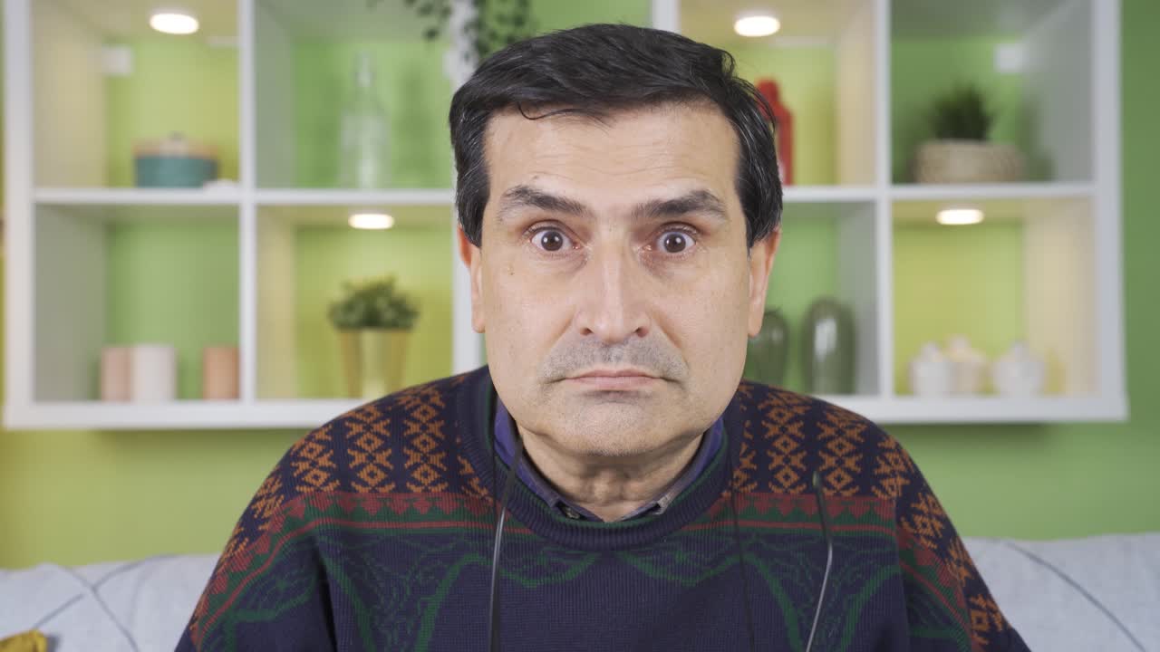 Mature man looking around suspicious and confused.