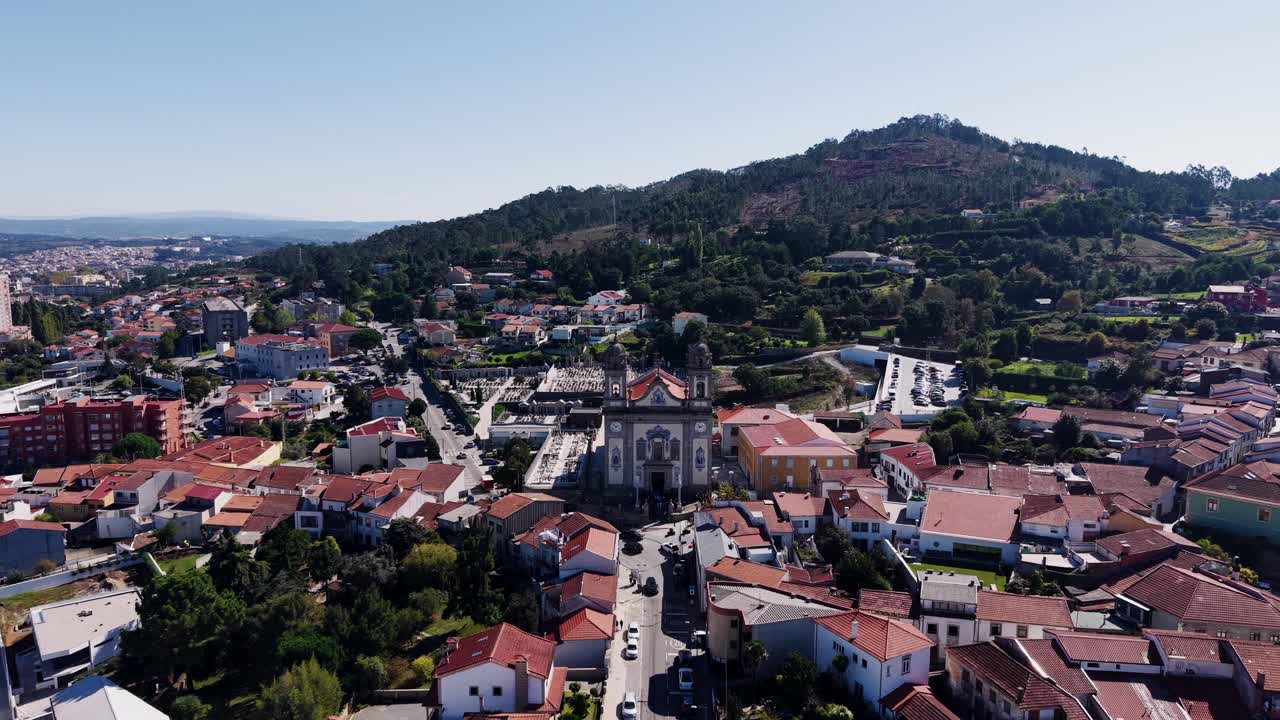 aerial approach view of Igreja Matriz de Valongo Portugal with town and hills