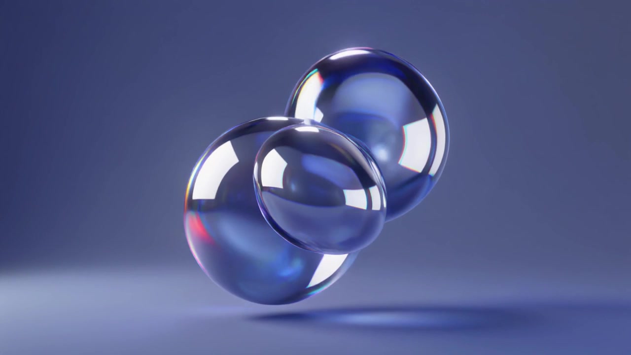 Abstract Animation of Merging Glass Spheres on Blue Background