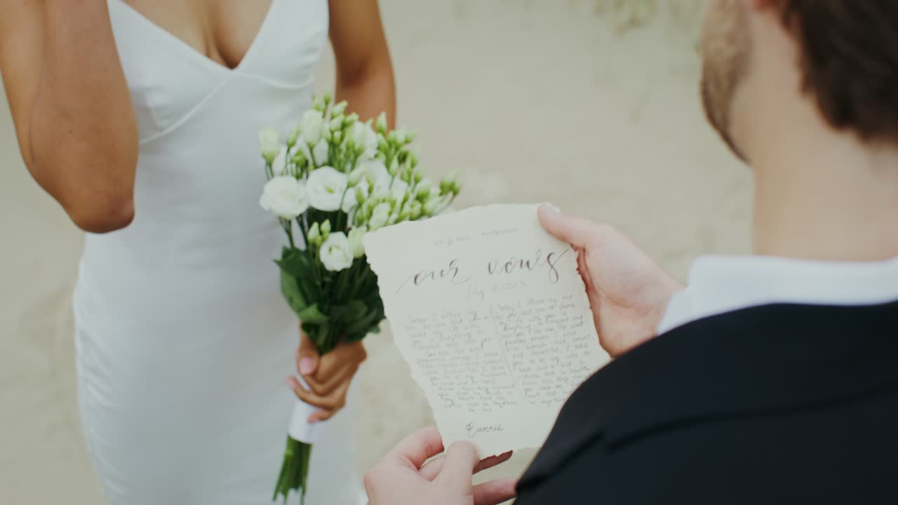 Bride and Groom Exchanging Vows at a Beach Wedding Ceremony
