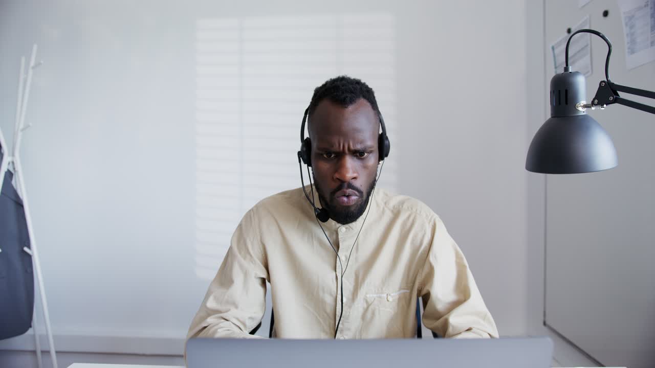 Stressed Businessman Working on Computer