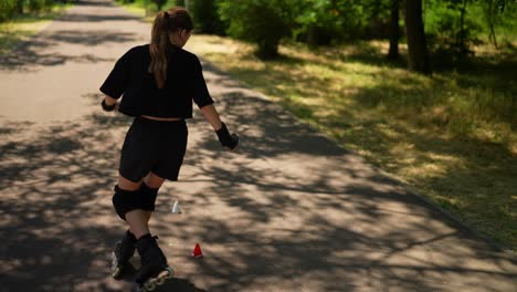 teenage girl roller skating in a park