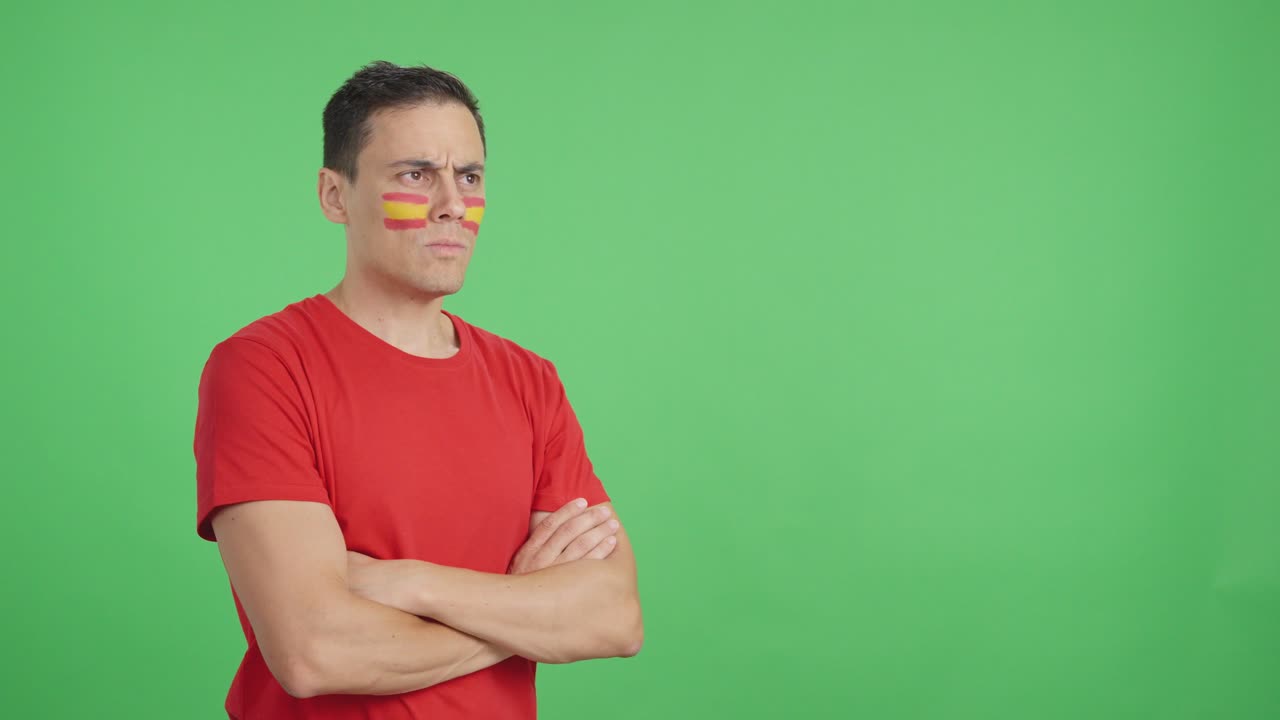 Spanish patriot man looking away with serious expression