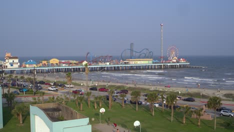 Drone-view-of-the-Pleasure-Pier-and-Galveston-Beach-in-Galveston,-Texas