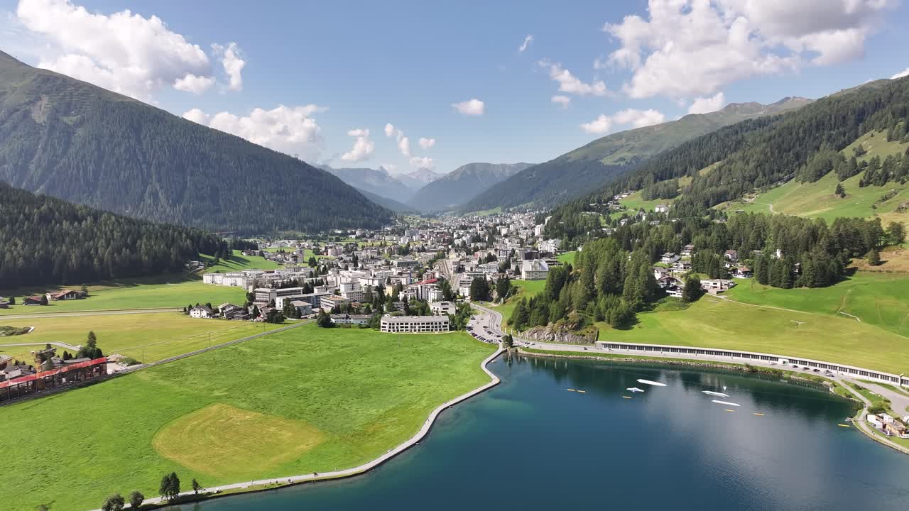 Aerial Drone view of Kanton Graubünden, Schweiz- Houses settlement along the Kanton Graubünden, Schweiz lake