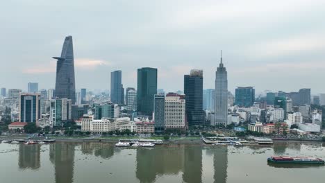 ho chi minh city skyline with modern skyscrapers and river view, overcast day, aerial shot