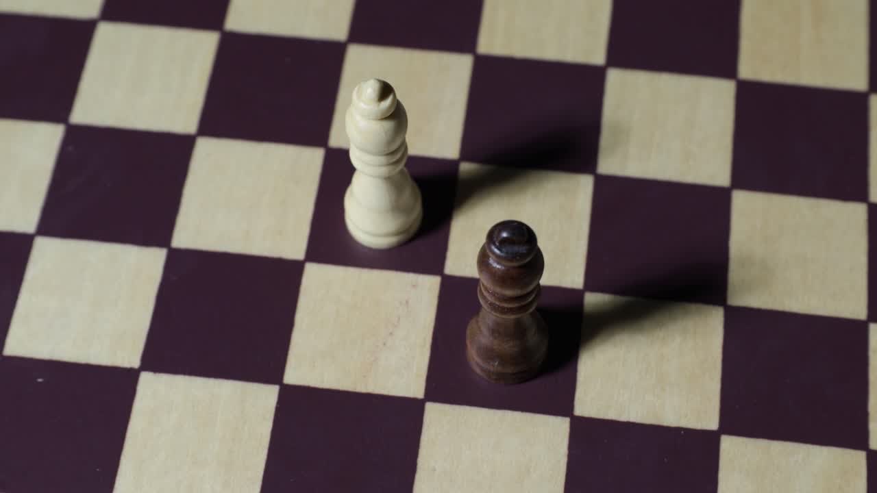 Cinematic shot of chessboard with queens rotating