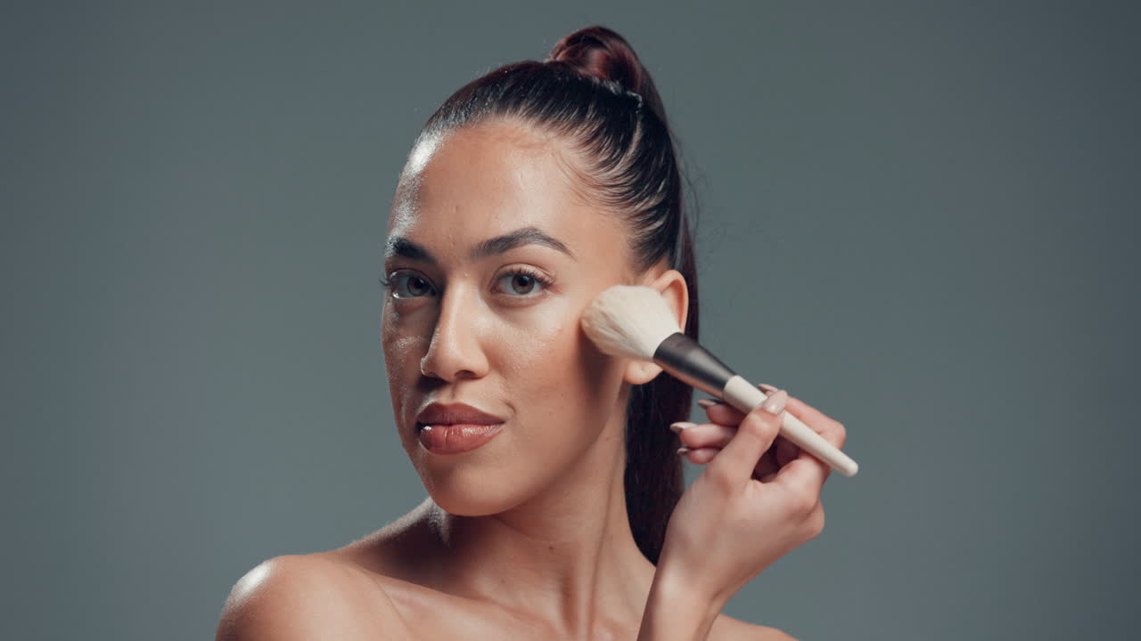 Woman applying makeup with brush