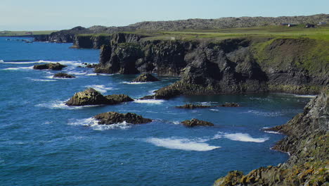 Slow-motion-footage-of-sea-waves-on-coast-line-with-cliffs-and-rocks-in-Arnarstapi-village-in-Iceland-on-Snaefellsnes-peninsula