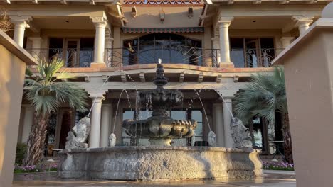 a classic stone fountain graces the courtyard of an office building in mccormick ranch, scottsdale, arizona