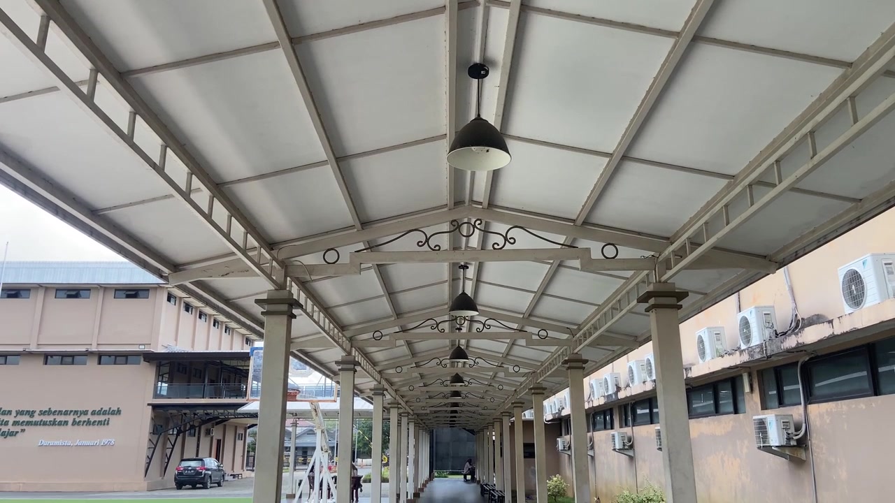 Long Outdoor Covered Walkway with Modern Design and Hanging Lamps