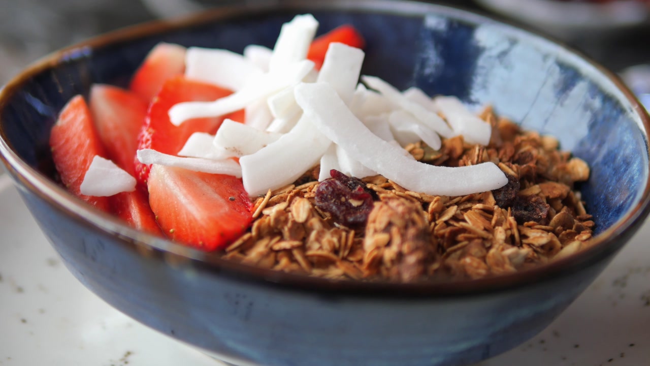 Healthy Granola Bowl with Strawberries and Coconut Flakes
