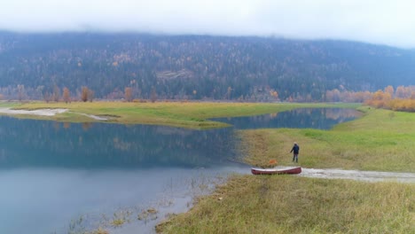 man walking with his dog near lakeside 4k