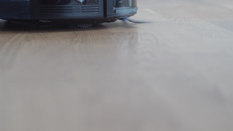 closeup shot of robot vacuum cleaning surface