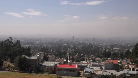panoramic view of a hazy urban cityscape with residential areas