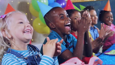 animation of gold confetti falling over happy diverse children clapping at birthday party