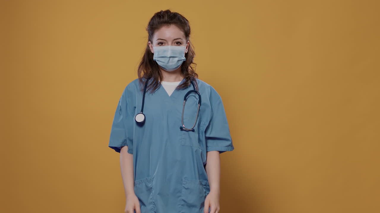 Healthcare worker with face mask and stethoscope