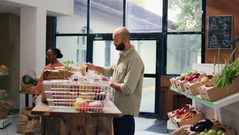 man at zero waste eco supermarket