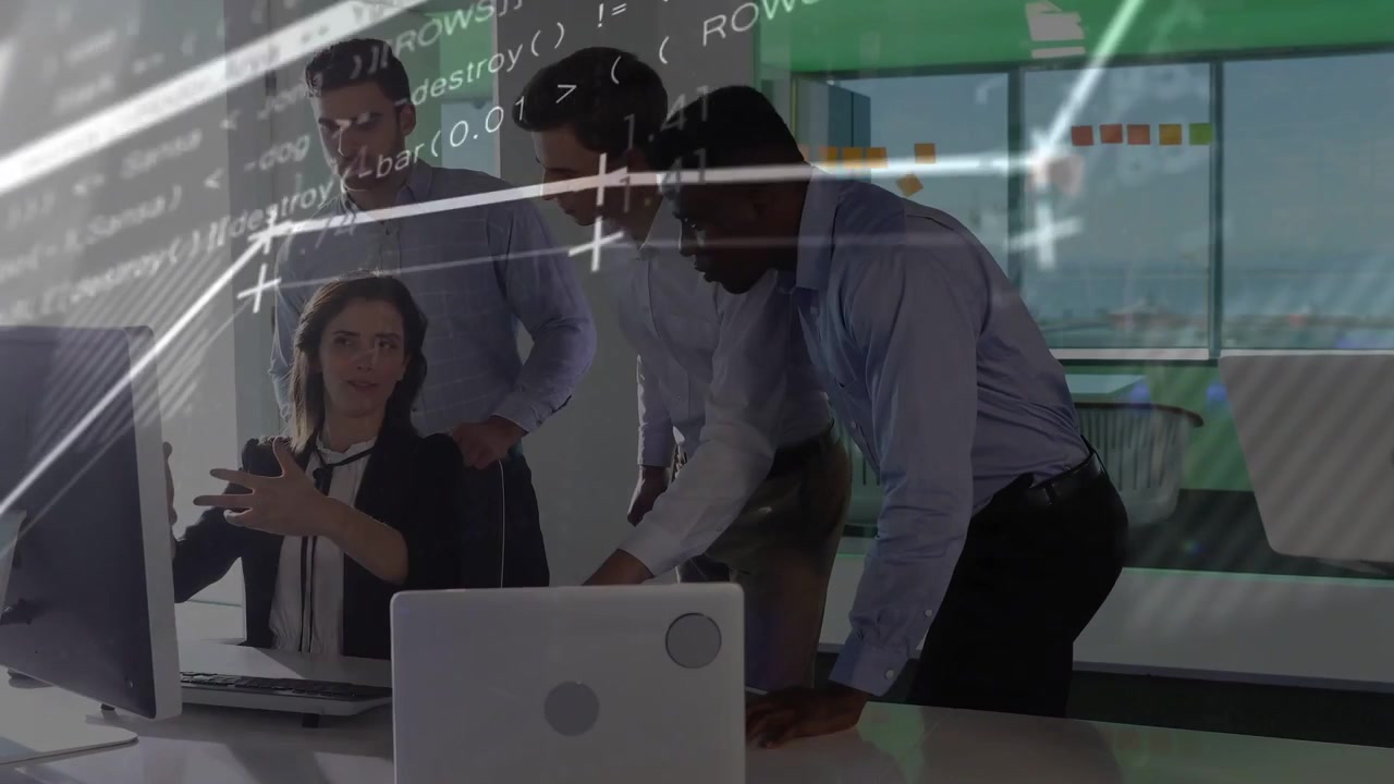 Seated woman pointing and typing at monitor, team leaning as overlay charts and code reviewing data
