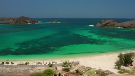 the white sand beach of tanjung aan in lombok, indonesia during a sunny day