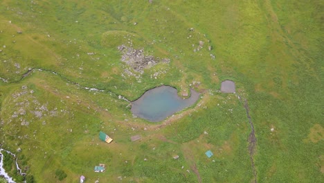 Aerial-shot-of-lake-and-river-caucasian-mountains