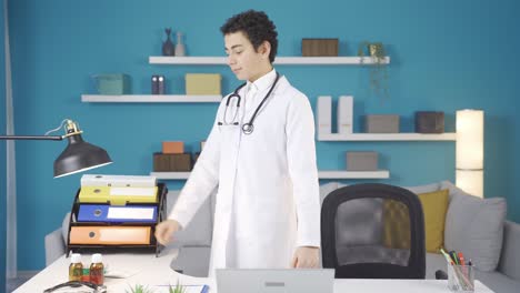 Happy-and-cheerful-boy-wearing-white-uniform-and-stethoscope-dreaming-of-becoming-a-doctor.