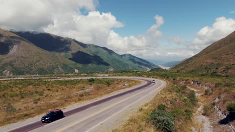 pickup truck driving on a scenic mountain road