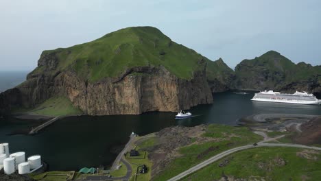 troll face shaped rock watching over the harbor in vestmann islands