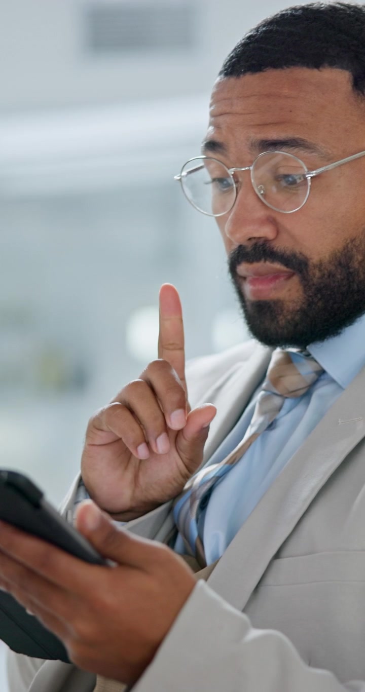 Professional Man Using Tablet and Thinking in Office