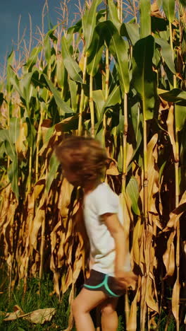 child running in a cornfield