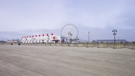 ferris wheel, beach, and boardwalk in ocean city nj tire prints in the sand ocnj