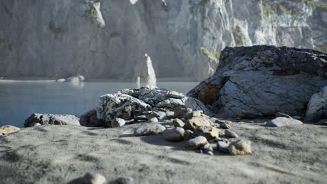 sand beach among rocks at atlantic ocean coast in portugal