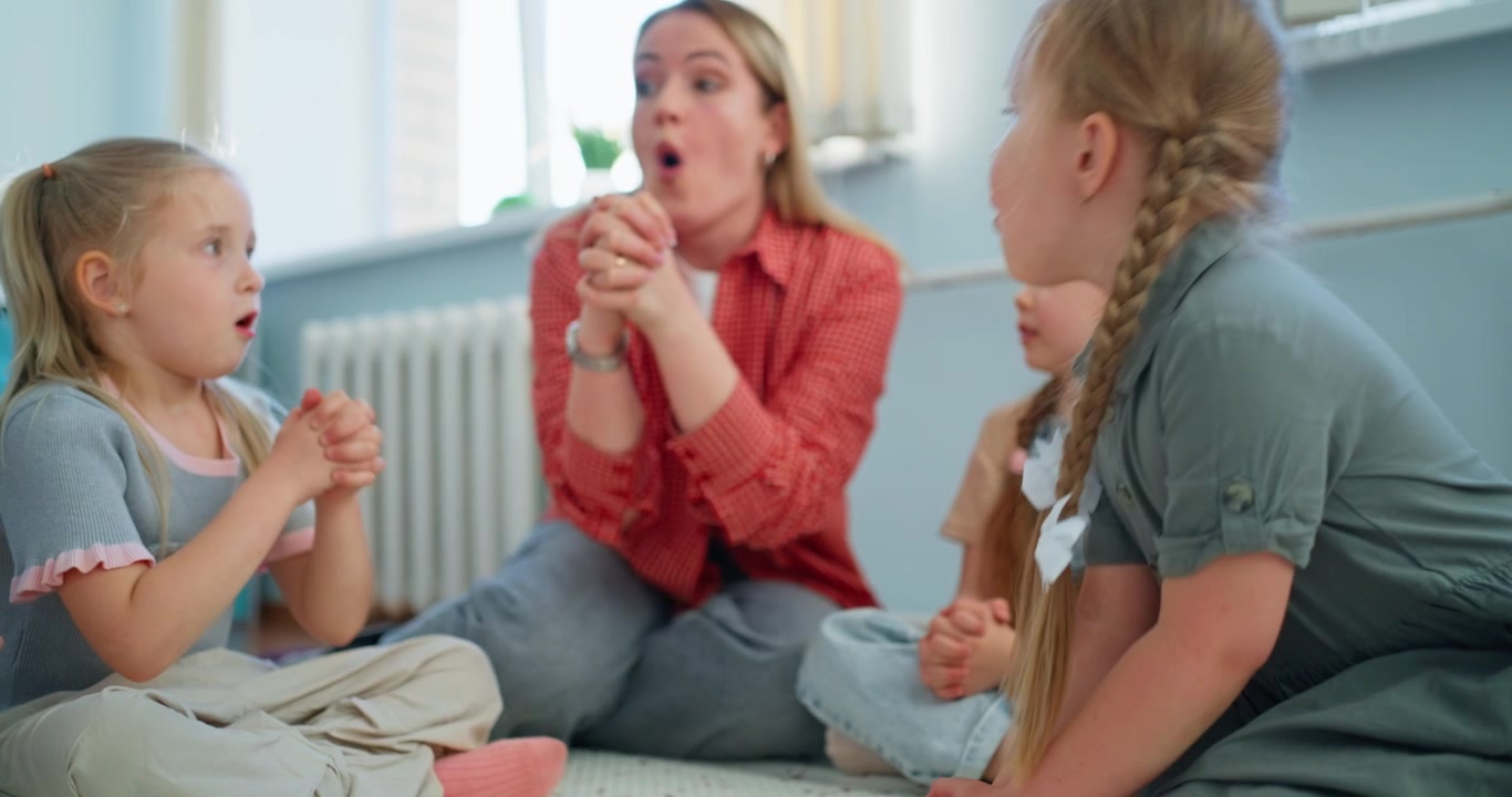 Female Teacher Engaging Young Children in a Group Activity
