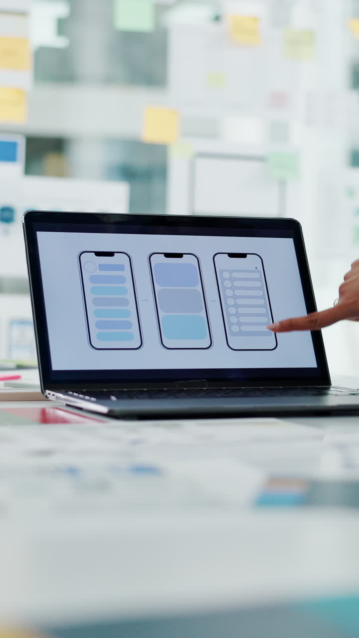 Hands Pointing at Mobile App UI UX Design on Laptop Screen