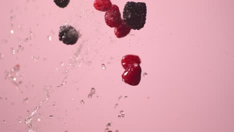 berries being tossed with water into the air