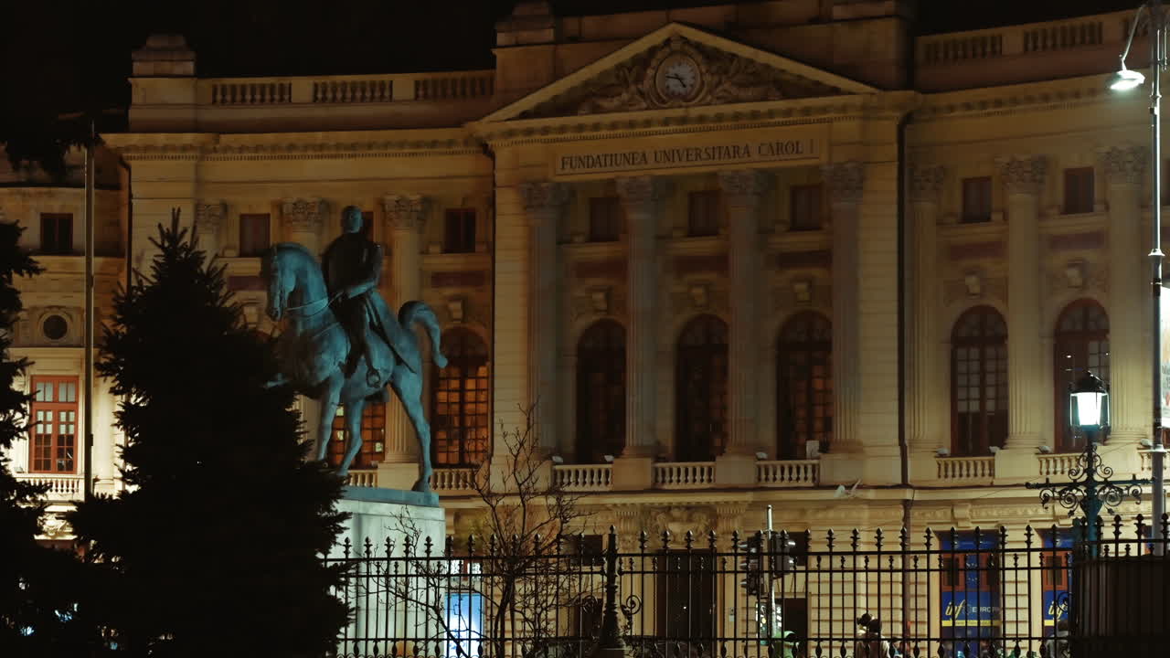 Bucharest, Romania - December 21, 2021: People walking in front of the Central University Library Carol I in the evening