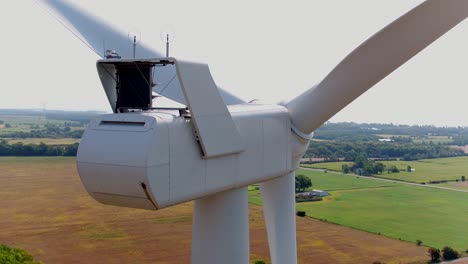 nacelle wind turbine from rear using a drone orbiting around for inspection