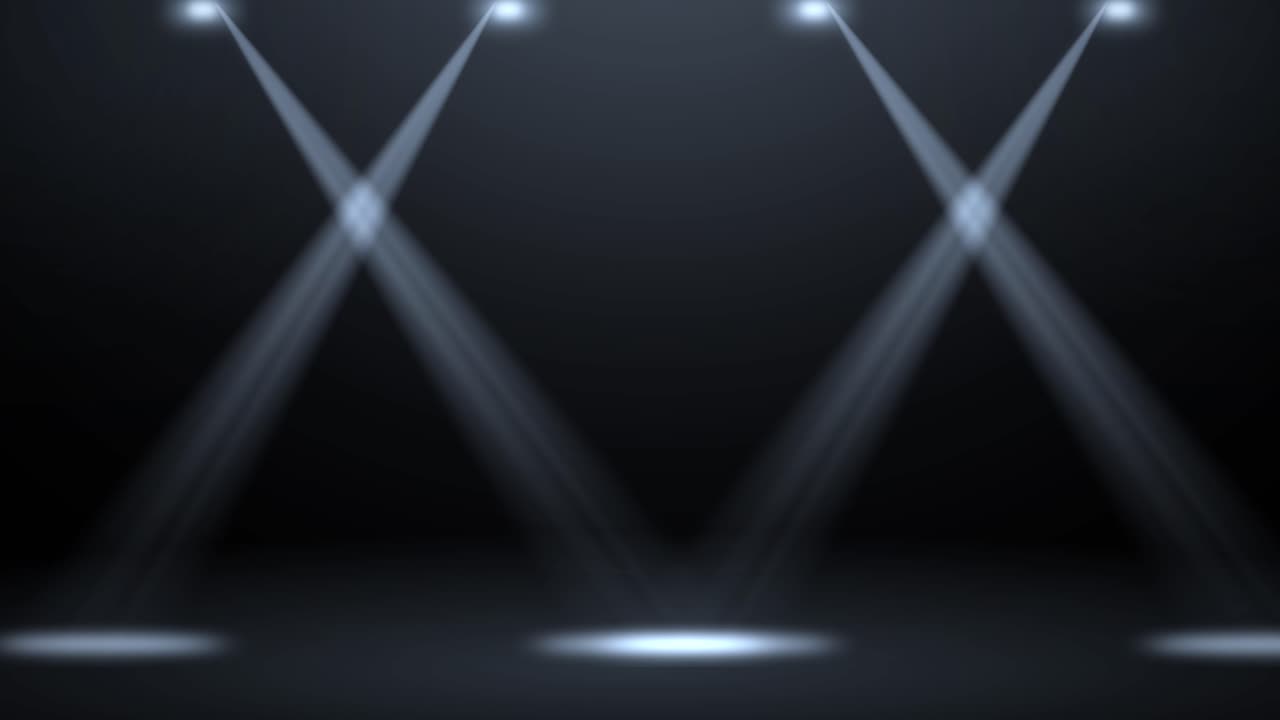 Moving spotlights on a dark stage