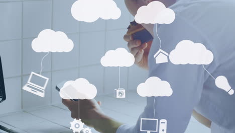 animación de nubes e iconos de medios sobre el hombre usando un teléfono inteligente