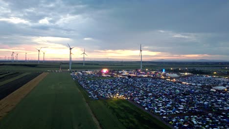 Panoramic-View-Of-Huge-Crowd-During-Nova-Rock-Festival-In-Pannonia-Fields-II,-Nickelsdorf,-Austria---drone-shot