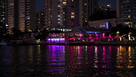 colorful lights reflecting on canal water