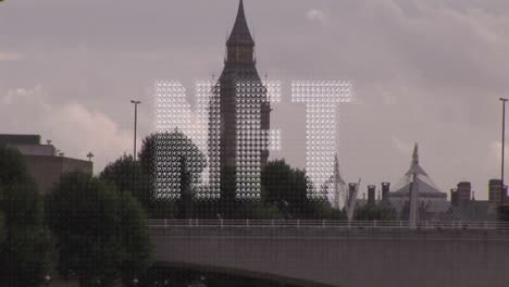 Animation-of-nft-text-banner-against-against-aerial-view-of-cityscape