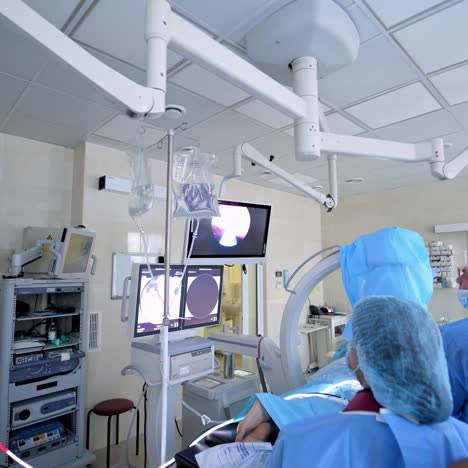 medical team performing surgical operation in bright modern surgery room. operating theatre. modern equipment in clinic