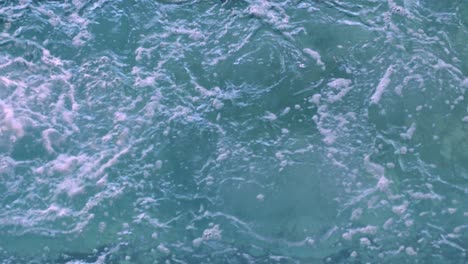 fit woman doing back stroke in swimming pool