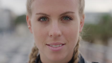 close up portrait beautiful blonde woman smiling turns head confident successful female wearing nose ring slow motion