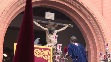 Religious Procession Featuring a Crucifixion Sculpture