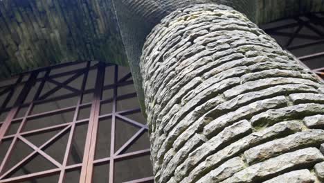 Rusty-metal-gate-doorway-ornate-stacked-stone-archway-historical-Rivington-columns-garden-building