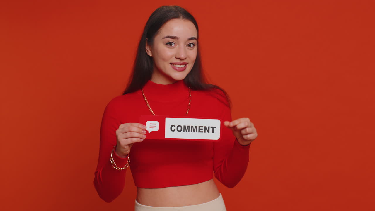 Woman holding share and comment signs, smiling at camera