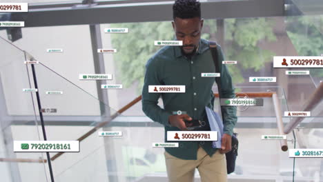animation of icons and data processing over african american businessman in office