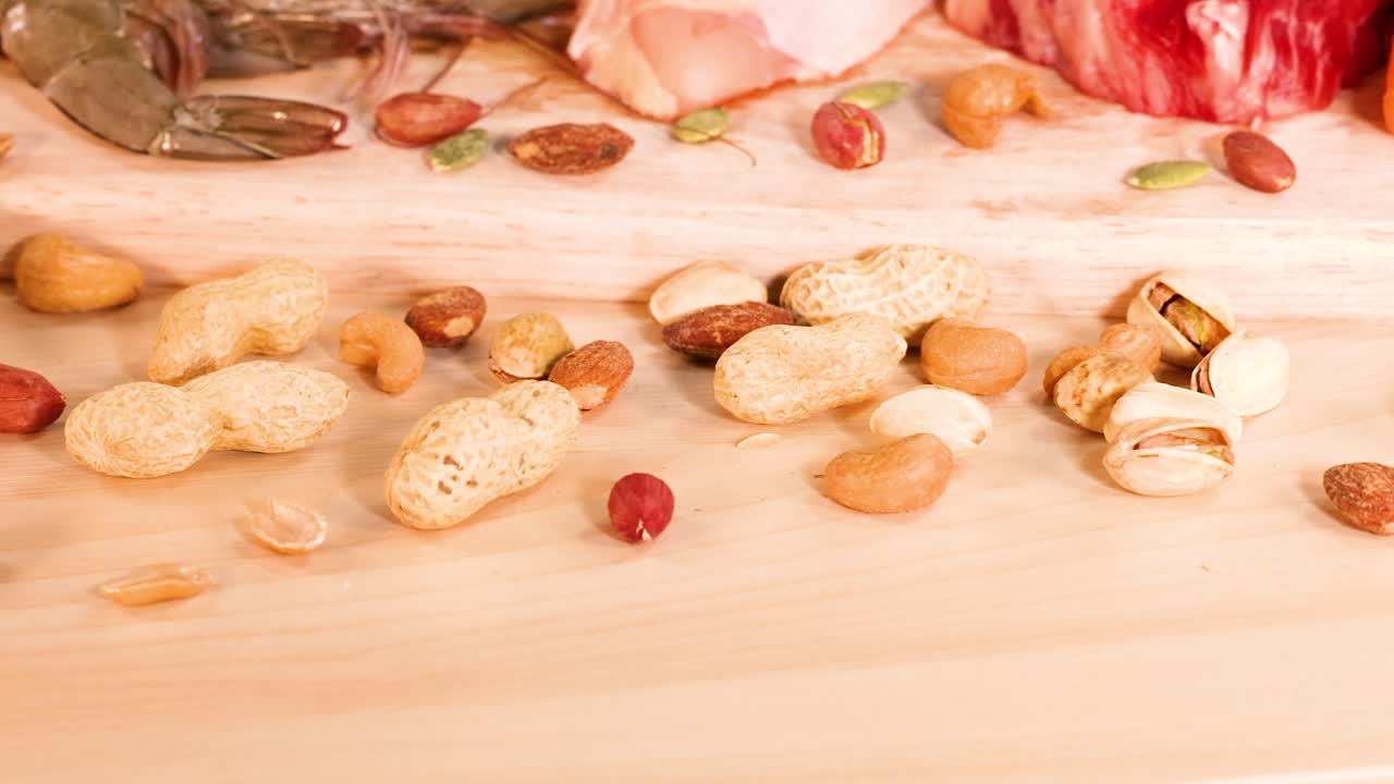 Variety of protein-rich foods displayed on wood